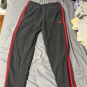 Black with red strips Adidas sweatpants